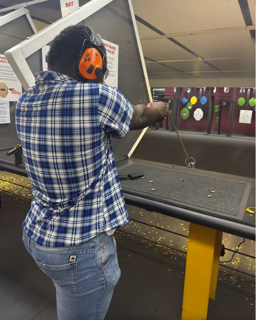 Kenneth aiming during action shooting
