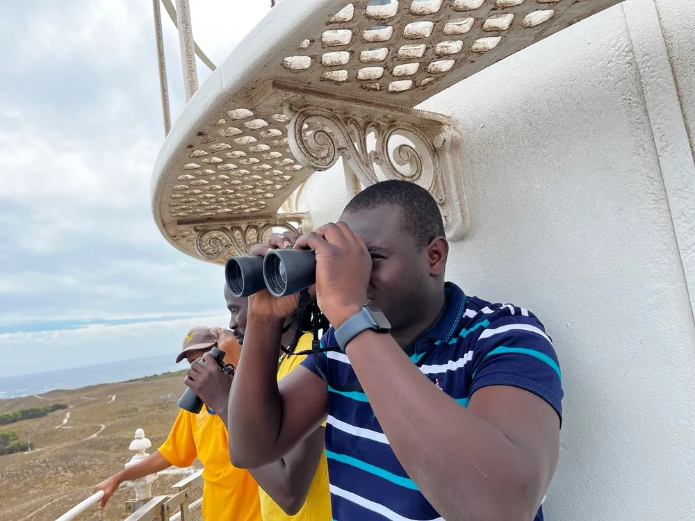 Kenneth looking through binoculars